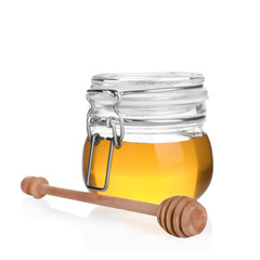 Jar of organic honey and dipper isolated on white
