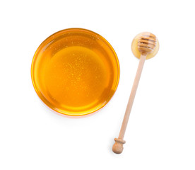 Bowl of organic honey and dipper isolated on white, top view