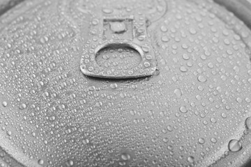 Drops of water on a metal can closeup.