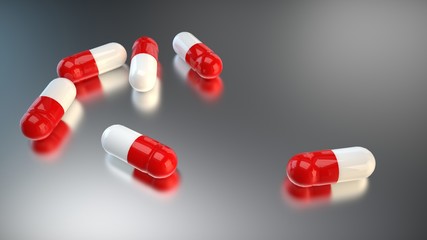 Six red white capsule pills on gray metallic surface. 3d render