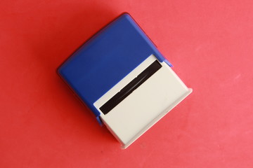 Automatic ink stamp manufactured in blue plastic