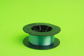 roll of nylon fishing line in color background