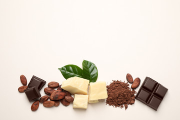 Flat lay composition with organic cocoa butter on beige background. Space for text