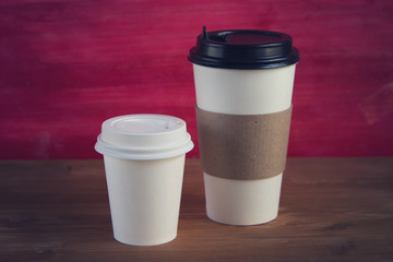 empty cardboard Cup on wooden background