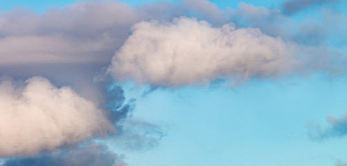 Fantastic clouds against blue sky, panorama