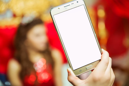 Your phone's screen is white and you can write text. The girl holds a gold phone in her hand.