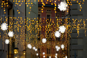 Gesandtenstraße in Regensburg with christmas light chain decoration during night