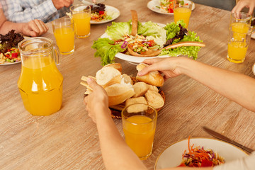 Salad with bread and orange juice as lunch