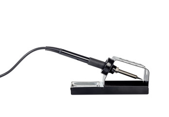 Electric soldering iron on a stand.