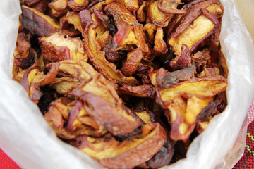 Dried apples. Dry fruits in paper bag.