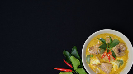 Top view of Thai chicken green curry on black desk background