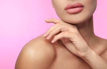 Obraz na płótnie Canvas Woman with matte lipstick on pink background, closeup
