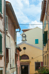 A small narrow street in the old seaside European city.