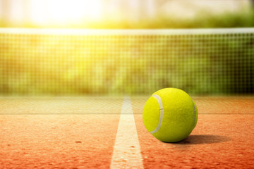 Closeup view of a tennis ball on the tennis court - obrazy, fototapety, plakaty