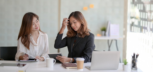 Cropped shot of young professional businesswomen discussing on the project together