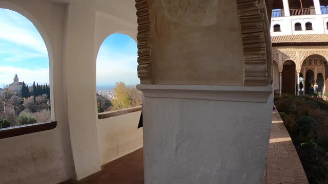 Tourists walking through the Generalife gardens in the Alhambra Palace. Granada, Andalusia, Spain.  4K shot.