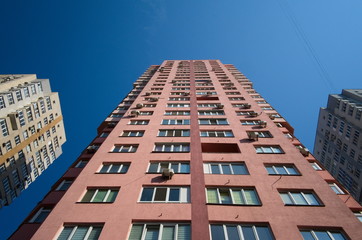 Fototapeta premium High modern apartment buildings in residential district of Kiev. High-rise houses for many families. Low angle wide view. Ukraine, Eastern Europe