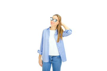 Portrait of a pretty smiling woman isolated on a white background.  Stylish young woman in sunglasses smiling.