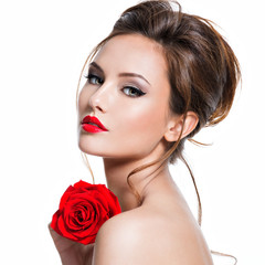 Closeup face of beautiful woman with red rose  bright makeup