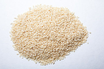 Organic natural sesame seeds on a white background