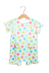 polka dot pink green blue on white baby clothes bodysuit front view in clothes hanger, isolated on white background.