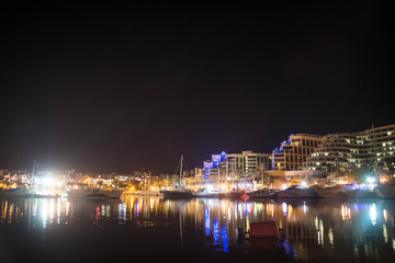 Fototapeta na wymiar Boats in Eilat marina at night, Israel