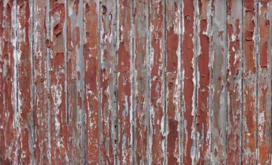 Cracked old brown paint on wood plank wall background.