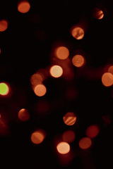 Yellow Bokeh of Light. Golden Bokeh of Light. Defocused light with black background.Night life light bokeh. Sparkle bokeh.