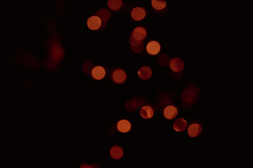 Yellow Bokeh of Light. Golden Bokeh of Light. Defocused light with black background.Night life light bokeh. Sparkle bokeh.
