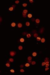 Yellow Bokeh of Light. Golden Bokeh of Light. Defocused light with black background.Night life light bokeh. Sparkle bokeh.