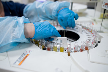 Close up scientist doing chemical test in modern laboratory. Selective focus