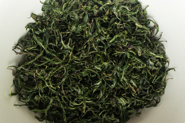 Twisted leaves of willow-tea in the fermentation process, home-made tea
