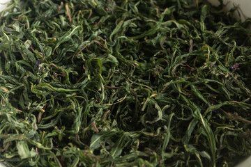 Twisted leaves of willow-tea in the fermentation process, home-made tea