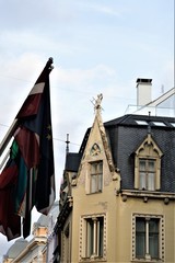 Riga, Latvia, November 2019. Flags of European countries on the ancient streets of the city.