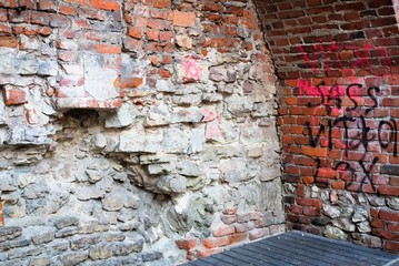 Riga, Latvia, November 2019. A fragment of the old fortress wall with modern additions.
