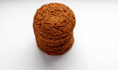 stack of whole grain cookies with outmeal isloated on white
