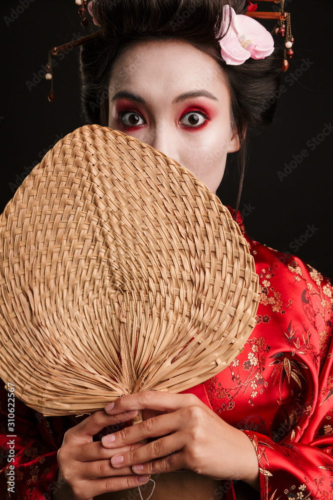 Sticker Image of young geisha woman in japanese kimono holding wooden hand fan