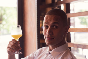 Business People Lifestyle. African American Man Working On Laptop In Cafe