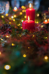 Table served for Christmas dinner, festive setting with decorations, burning candles, selective focus