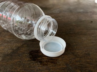 Plastic bottle on wooden background