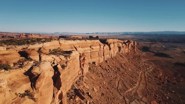 Drone Panning Right Above Majestic Flat Top Mountain Canyon Ridge With Epic View Of American Sunny Desert Skyline