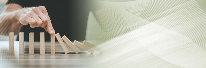 Concept of business control by stopping domino effect; panoramic banner