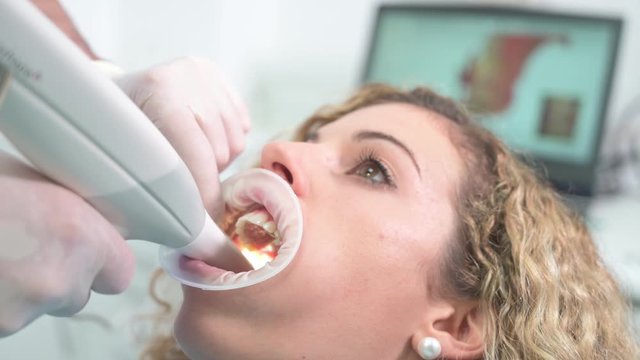 Dentist using innovative 3d ultrasound for dental check