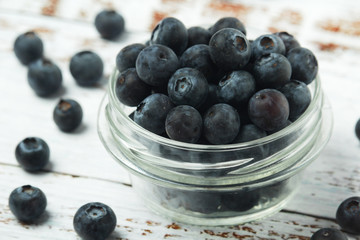 A glass bowl with blueberry