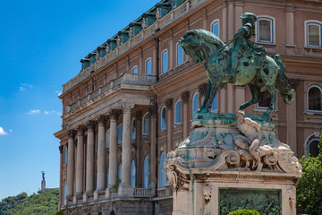Fototapeta na wymiar Equestrian monument to Eugene of Savoy in Budapest on the background of an old building with columns