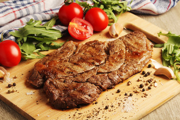 A beef steak well done with vegetables	