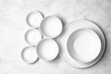 White plates isolated on a light background. Table setting. Top view copy space.