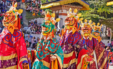 Performers dancers wearing masks in festival in Mongar, Bhutan - obrazy, fototapety, plakaty