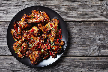 crispy teriyaki chicken wings on a plate