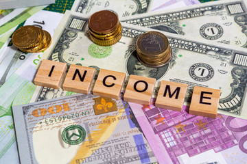 word text income on the money banknotes background